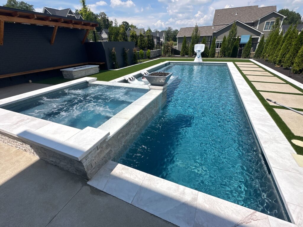 Lap pool with raised spa serviced by Bright Water